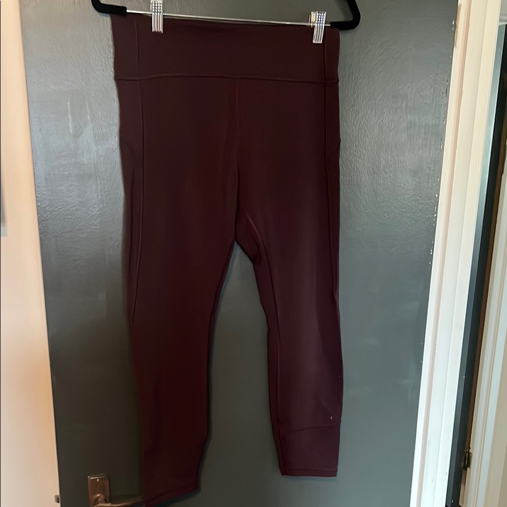 Lululemon leggings burgundy. Women’s size 12 wunderunder side pockets